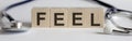 FEEL medicine word written on wood block