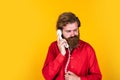 Feel sad about conversation. mature hipster with beard with retro phone. brutal caucasian guy speak on telephone