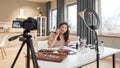 Feel the social experience. Asian female blogger applying makeup while recording a tutorial video for her beauty blog Royalty Free Stock Photo