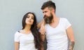 Feel their style. Couple white shirts cuddle each other. Hipster bearded and stylish girl hang out urban romantic date