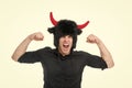 Feeling so angry. Man shouting face wears hat of devil with horns. Guy black shirt angry aggressive demonstrate strength Royalty Free Stock Photo