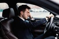 Sad businessman driving alone in his new car Royalty Free Stock Photo