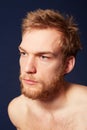 Feeling a bit bleak.... Cropped view of a young man looking away. Royalty Free Stock Photo