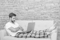 Feeling comfortable. domestic lifestyle with mobile abuse. handsome man online dating. relaxed man on sofa. guy enjoying Royalty Free Stock Photo