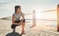 Feeling energised again. a young sporty woman crouching outside. Royalty Free Stock Photo