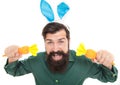 Feeling excited. funny man in rabbit ears. easter man hold carrot isolated on white. Royalty Free Stock Photo