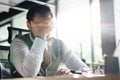 Feeling exhausted. Frustrated middle-aged beard man keeping eyes closed while sitting at his working place in office