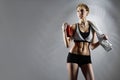 Feeling fit. Female fitness trainer wearing sports clothing posing