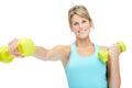 Feeling good about getting into shape. Sporty young woman lifting dumbbells while isolated on white. Royalty Free Stock Photo