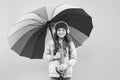 Feeling good. Girl having fun walking wireless headphones under colorful umbrella. Fall leisure. Music always with me Royalty Free Stock Photo