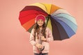 Feeling good. Girl having fun walking wireless headphones under colorful umbrella. Fall leisure. Music always with me Royalty Free Stock Photo