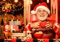 Feeling good at home. Senior man Santa claus drinking tea. New year celebration. Hot beverage. Christmas cocoa recipe