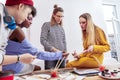 Four students of art school feeling joyful while studying