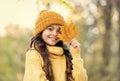 Feeling the nature. knitwear warm you in any weather. girl in yellow sweater and hat. kid enjoy nature in autumn park Royalty Free Stock Photo