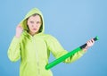 Feeling power. Woman play baseball game or going to beat someone. Girl hooded jacket hold baseball bat blue background