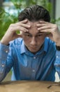 Feeling sick and tired. Frustrated young man keeping eyes closed Royalty Free Stock Photo
