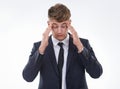 Feeling the stress of every deadline. a stressed out business man against a white background. Royalty Free Stock Photo