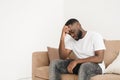 Feeling stressed and upset. Frustrated handsome young man touching his head while worrying about breakup or job loss and Royalty Free Stock Photo