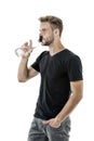 Feeling thirsty. Man athlete hold water bottle. Guy drink water on white background. Man care health and water balance Royalty Free Stock Photo