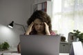 Feeling tired and stressed. Young Asian businesswoman sitting with eyes closed from exhaustion and tiredness during working at hom Royalty Free Stock Photo