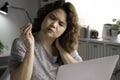 Feeling tired and stressed. Young Asian businesswoman sitting looking exhausted and tired during working at home office using lapt Royalty Free Stock Photo