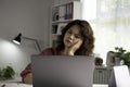 Feeling tired and stressed. Young Asian woman sitting looking deep in thought exhausted and tired during working at home office us Royalty Free Stock Photo