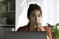 Feeling tired and stressed. Young Asian woman sitting looking deep in thought exhausted and tired during working at home office us Royalty Free Stock Photo