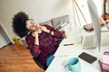 Feeling tired after studying online all day. Young afro american woman massaging neck and relaxing after long computer Royalty Free Stock Photo