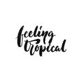 Feeling tropical - hand drawn Summer seasons holiday lettering phrase isolated on the white background. Fun brush ink