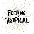 Feeling tropical. Lettering phrase on light background. Design element for poster, t shirt, card.