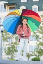 Feeling warm. Optimist and cheerful child. Spring warm. Positive mood in autumn warm weather. Multicolored umbrella for