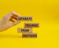 Feelings and Emotions symbol. Concept word Separate Feelings from Emotions on wooden blocks. Beautiful yellow background. Doctor