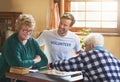 It feels good to do good. a volunteer working with seniors at a retirement home. Royalty Free Stock Photo