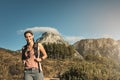 Feels great to be out in the fresh air again. a young woman out on a hike through the mountains.