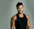 It feels great to be in shape. Studio portrait of an athletic young man posing against a gray background. Royalty Free Stock Photo