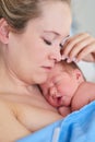 This feels like a dream come true. a beautiful young mother and her newly born baby girl sleeping in a hospital bed Royalty Free Stock Photo