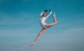 Feels like flying. Young ballerina jumping on blue sky. Pretty girl in dance wear. Cute ballet dancer. Concert Royalty Free Stock Photo