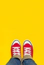 Feet From Above, Teenager in Sneakers Standing on Yellow Backgro Royalty Free Stock Photo