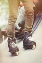 Feet of aggressive inline rollerblader on outdoor skatepark Royalty Free Stock Photo