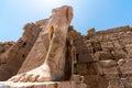 Feet of an ancient statue of Pharaoh in the Karnak temple in Luxor