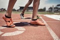 Feet, athlete and sports race at stadium for marathon or sprint competition with people ready to start running and Royalty Free Stock Photo