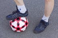 Feet athletes-women with a soccer ball