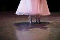 The feet of ballerinas on the stage