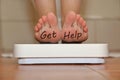 Feet on bathroom scale