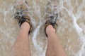 Feet in beach sand