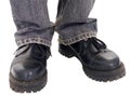 Feet in the big black boots Royalty Free Stock Photo