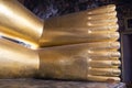 Feet of big golden statue of Reclining Buddha in temple Wat Pho. Bangkok Royalty Free Stock Photo