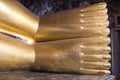 Feet of big golden statue of Reclining Buddha in temple Wat Pho. Bangkok Royalty Free Stock Photo