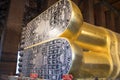 Feet of big golden statue of Reclining Buddha in temple Wat Pho. Bangkok