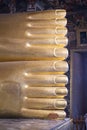 Feet of big golden statue of Reclining Buddha in temple Wat Pho. Bangkok